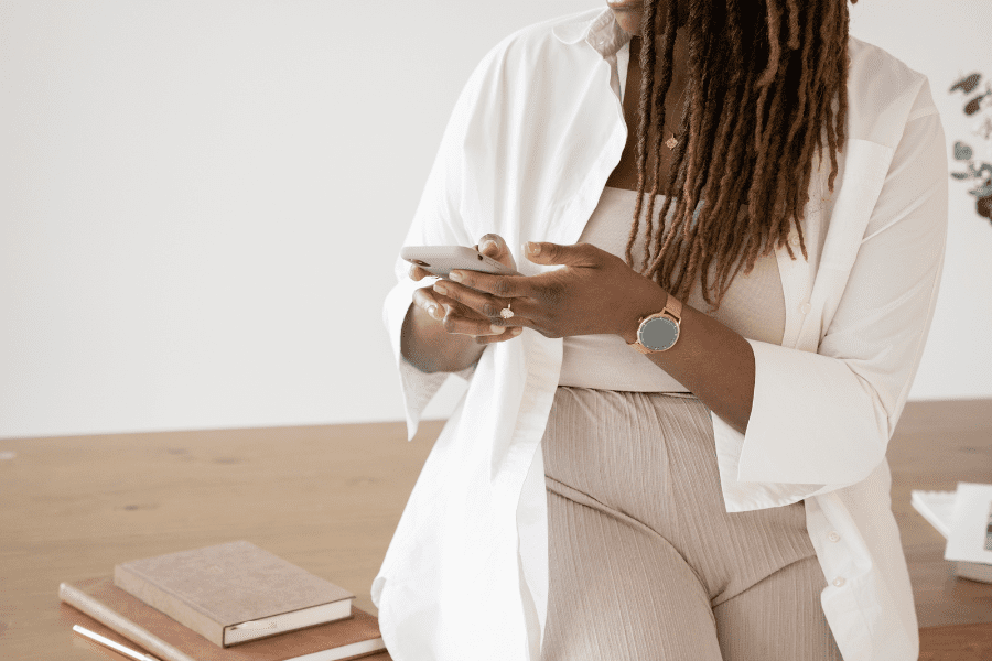 busy woman texts on her phone